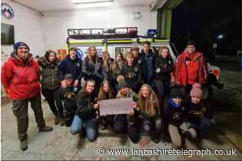 Turton Young Farmers present Bolton Mountain Rescue with a cheque