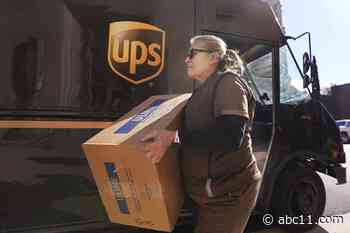 UPS reports record profit but forecasts a slower 2023