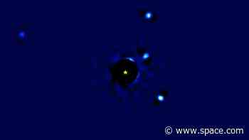 Exoplanets dance around distant star in stunning 12-year timelapse (video)