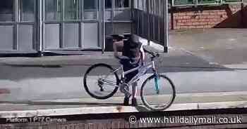 Yobs throw bike onto train track putting lives at risk