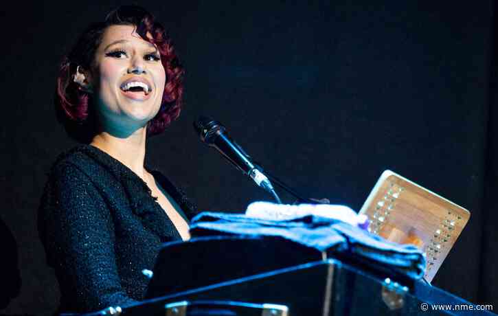 RAYE installs album artwork display outside former label’s office