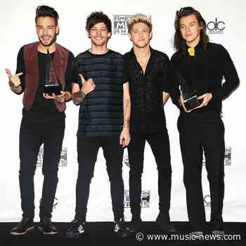 Liam Payne and Niall Horan congratulate Harry Styles on winning Album of the Year Grammy