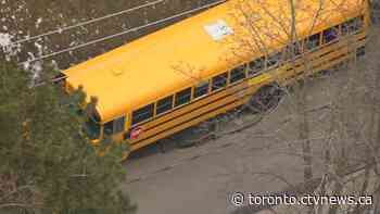 Firefighters on scene after sink hole forms under school bus in the Beaches