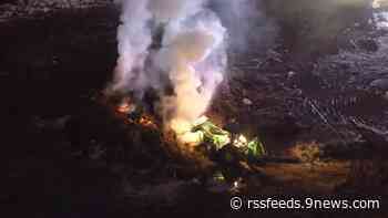 Fire crews extinguish brush pile fire at Sloan Lake