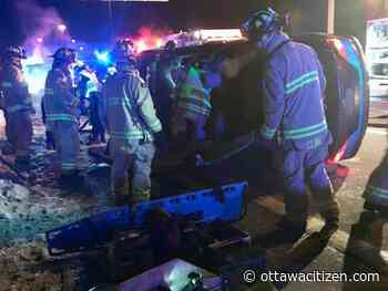 Firefighters free driver from flipped car after Queensway crash