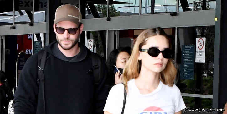 Liam Hemsworth & Girlfriend Gabriella Brooks Land in Australia as Miley Cyrus Tops the Charts a Third Week with 'Flowers'