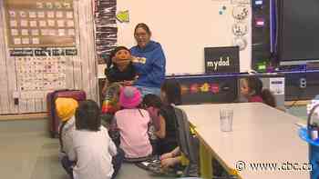 Indigenous language teacher using puppet as a fun way to deliver lessons