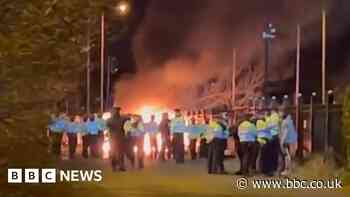 Police van set on fire outside asylum seeker hotel