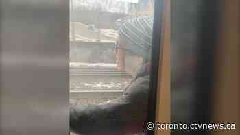 Passenger who appears to miss GO Train clings to side as it departs station