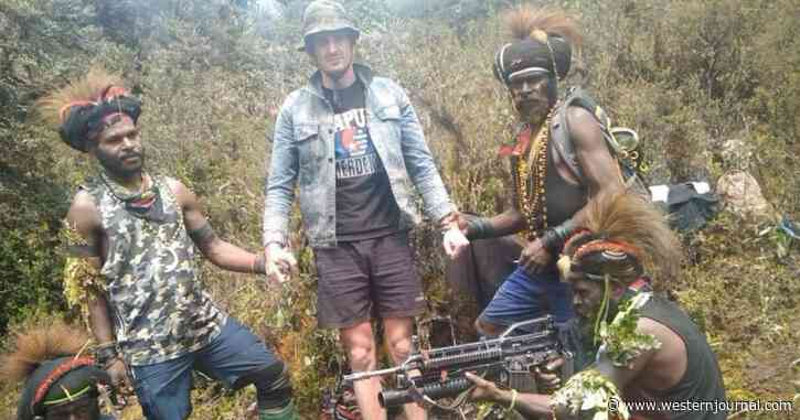 Pilot Taken Hostage by Islanders, Shown Surrounded by Spears, Bows and Arrows