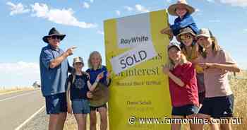 Selling agents celebrate a big farm sale with the grandkids