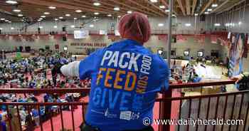 Packing hope: Volunteers prepare 500,000 meals for hungry kids