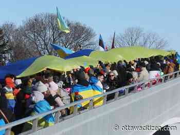 Huge flag unfurled as diplomatic community gathers to demonstrate support for Ukraine