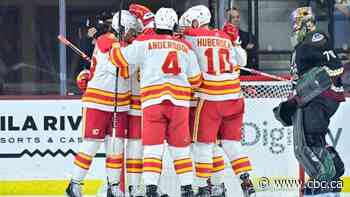 Flames use strong final frame to put end to Coyotes' point streak at 9 games
