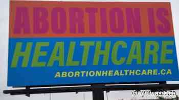 Volunteers say they won't be silenced after 'abortion is healthcare' banner vandalized in Regina