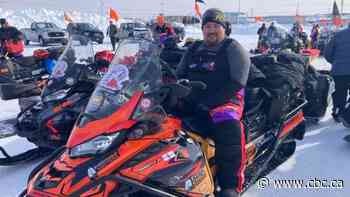 A hero's welcome and caribou stew as Indigenous-led snowmobile expedition winds north