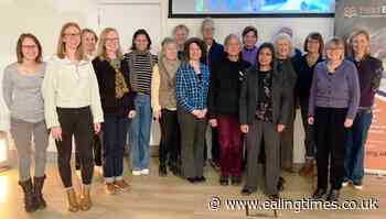 Ealing reading volunteers explain their work to MP