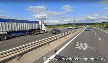 M65 closed near Blackburn after lorry crashes into car