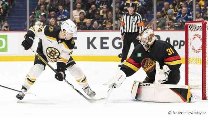 Goalie Ullmark scores as Bruins beat Canucks 3-1