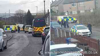 Police vans and officers descend on Oban Drive, Blackburn