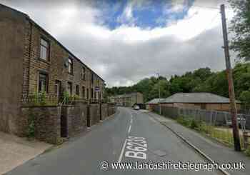 Burnley Road East closed after man suffered head injury
