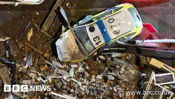 Bradford police car crash causes damage to row of buildings