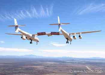 Virgin Galactic's carrier plane flies back to New Mexico spaceport