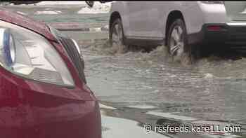 City crews clear clogged street drains and flooded roads