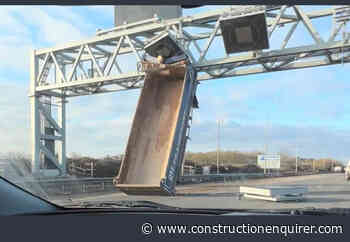 Tipper truck hits overhead motorway gantry