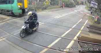 Watch as moped narrowly misses train travelling at 70mph after jumping level crossing