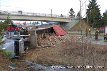 Dump truck crashes and spills load of garbage along Nanaimo Parkway