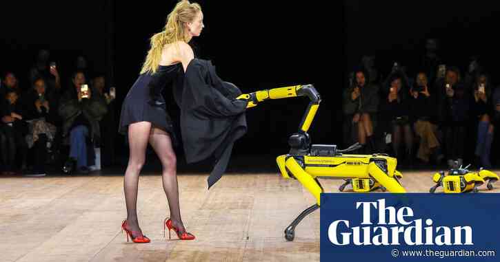 Models and robots share the runway at Coperni fashion show