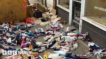 Outrage as hundreds of New Balance trainers found in skip