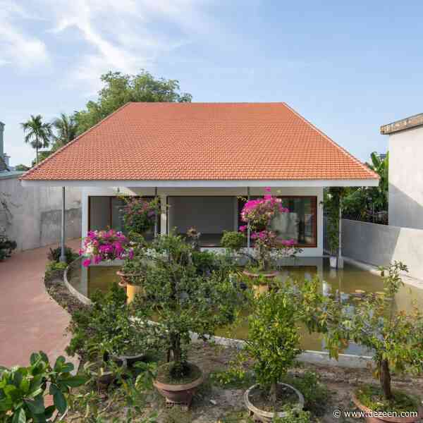 Oversized roof shelters family home in Vietnamese walled garden