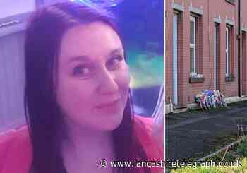 Floral tributes left at house of Mill Hill woman found dead