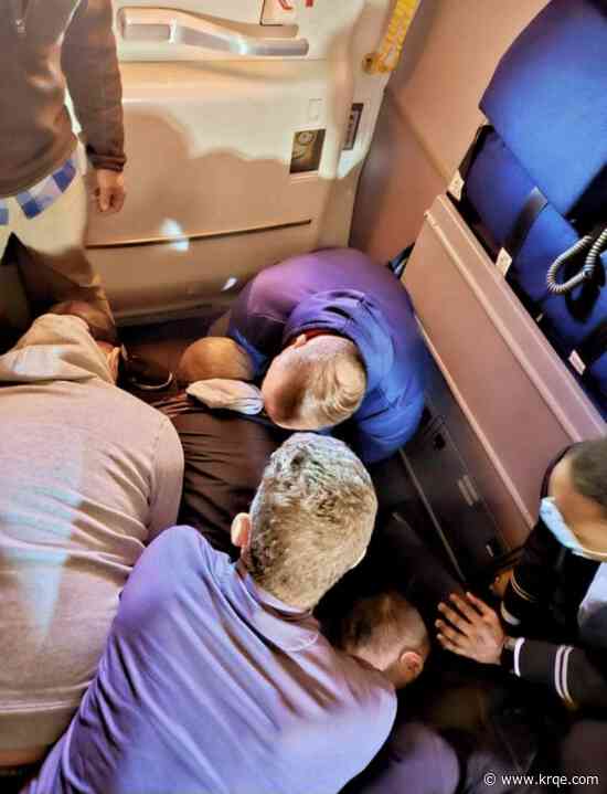 Passengers restrain man who tried to stab flight attendant