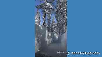 WATCH:  Driver braves towering walls of snow