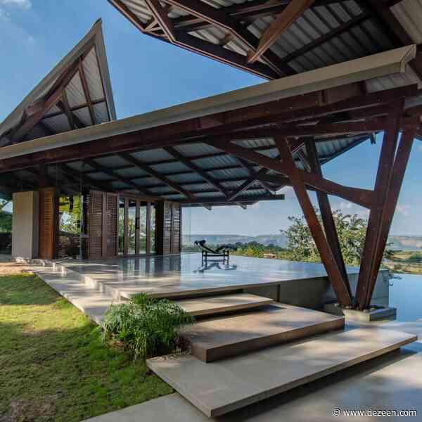 Angular metal canopies shelter Indian house by Malik Architecture