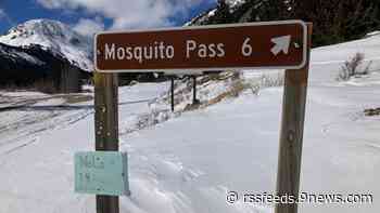 Hydrologists hand-measure snowpack in the Colorado mountains