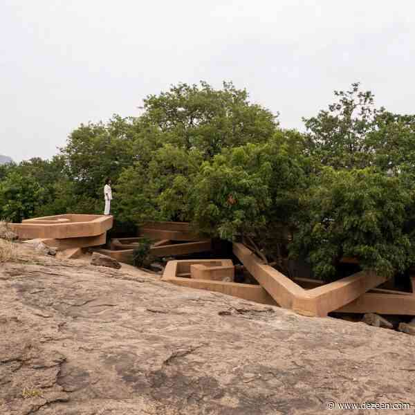 Sculptural house in India resembles "snake curling up under a rock"