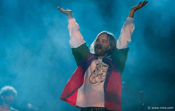 Watch Tame Impala’s Kevin Parker perform on crutches with fractured hip in Mexico