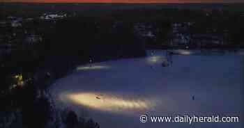 Suburban Skyview: Sunset sledding in Island Lake