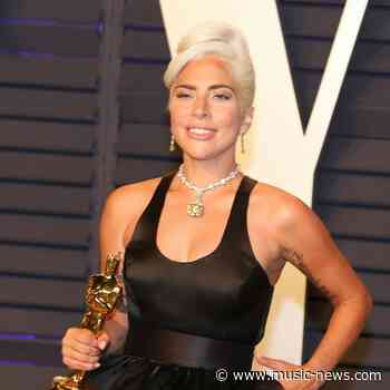 Lady Gaga rushes to help photographer who falls on Oscars red carpet