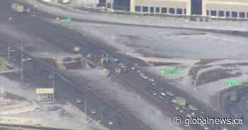 Truck flips after hitting parked vehicle, shutting down Deerfoot Trail