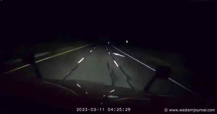 What Do You See? Truck's Camera Catches Ghost-Like Figure on Lonely Stretch of Desert in Middle of Night