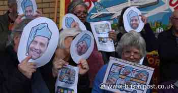 Protesters wear masks of napping politicians in demand for better bus services for Bristol region