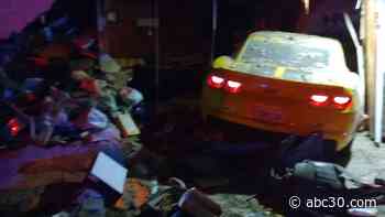 Family displaced after car crashes into central Fresno home