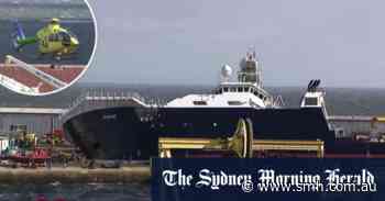 Large ship tips onto dock in Scotland