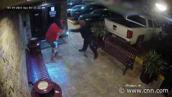 Strip club bouncers fight off, disarm masked man with a gun