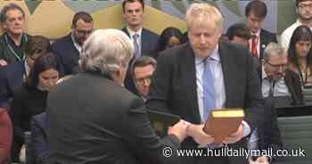 Johnson fighting for political future after combative partygate inquiry hearing